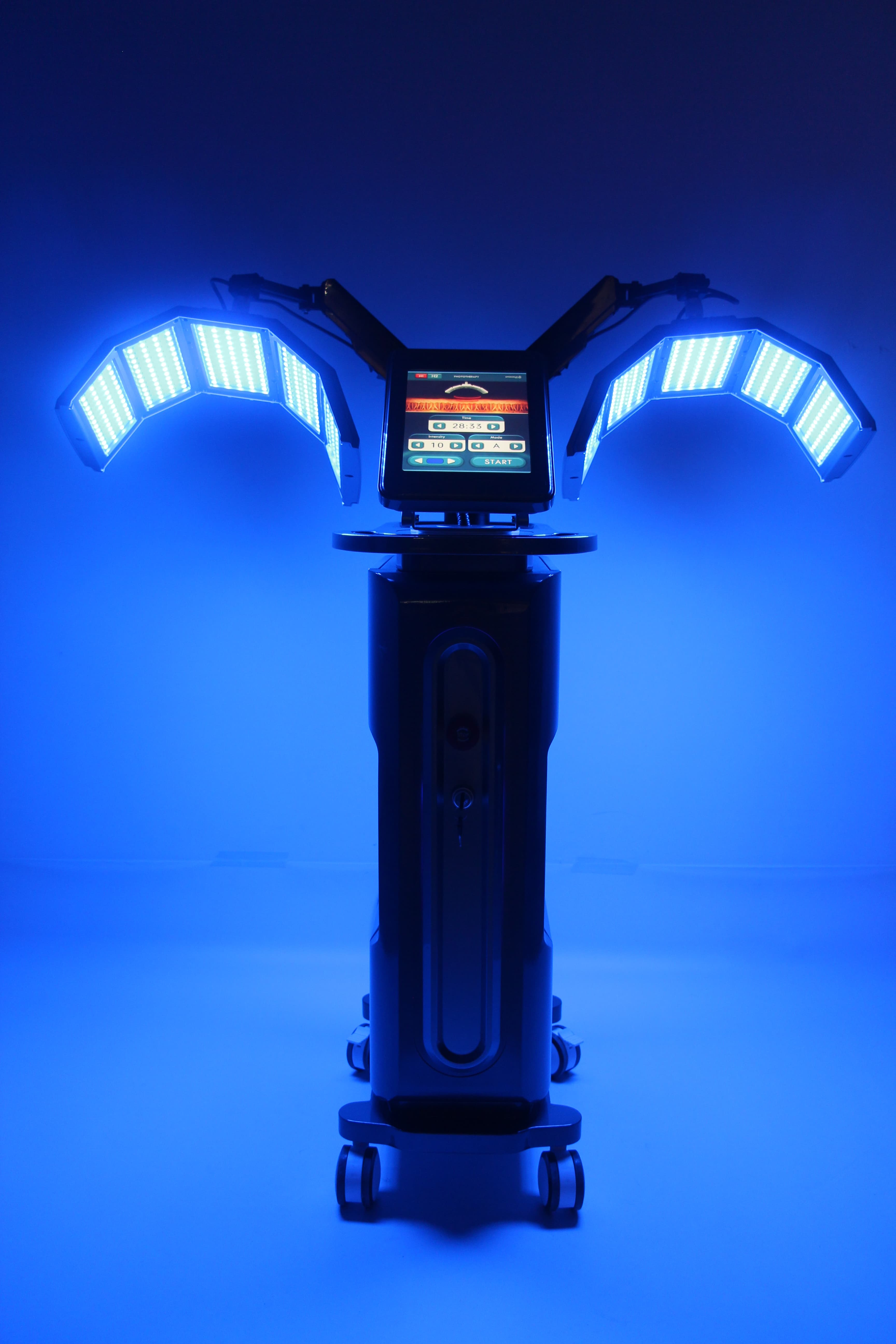 Máquina de fototerapia LED con controles de pantalla táctil, sobre fondo azul.