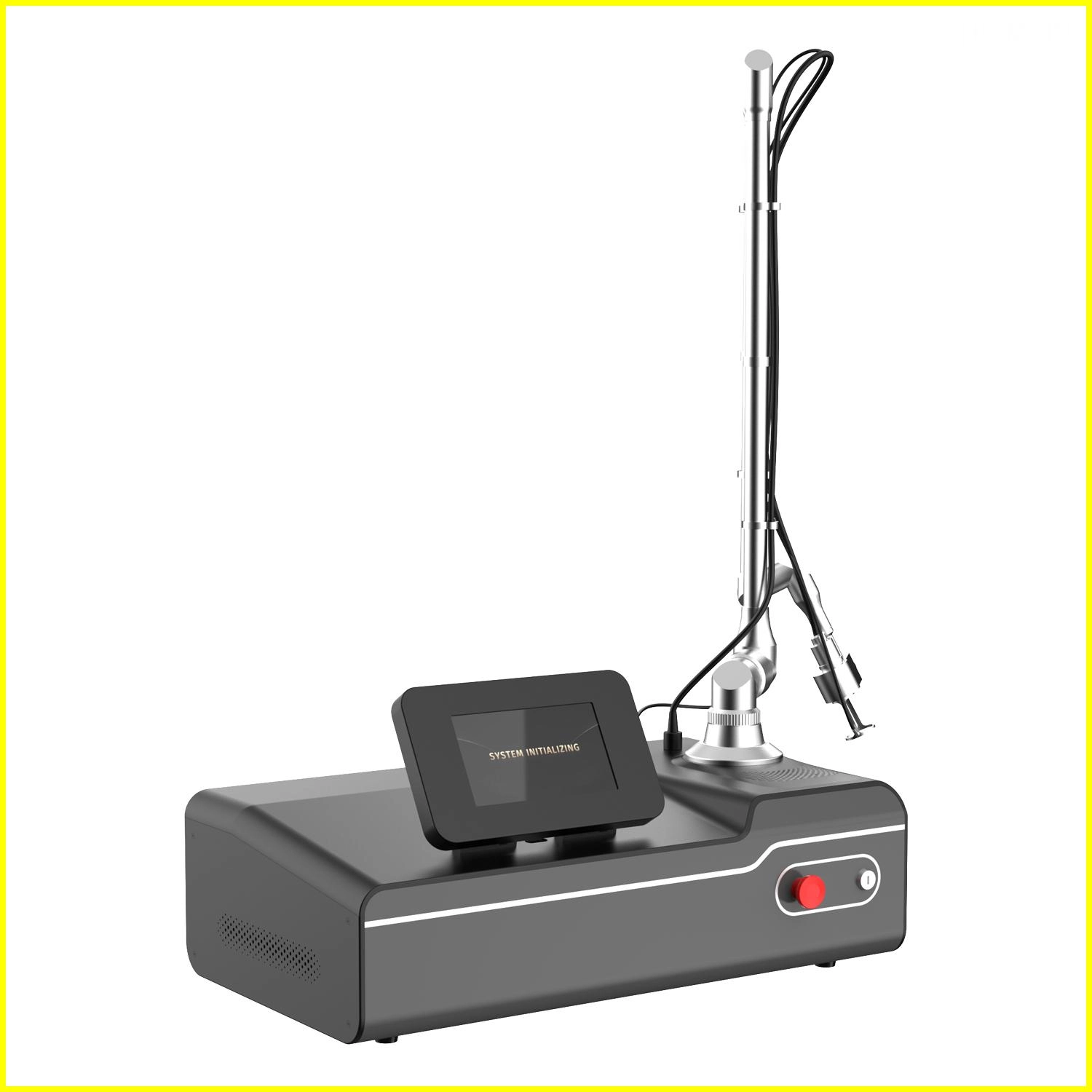 Gray and silver fractional CO2 laser device with a touchscreen display showing SYSTEM INITIALIZING - HUIMAIN